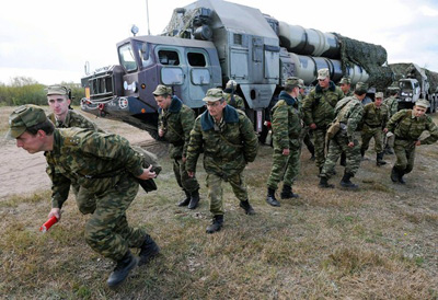 Russia drew praise from the U.S. for not selling Iran an air defense system such as the S-300, used in a joint exercise in Belarus. (Viktor Drachev, AFP/Getty Images / September 21, 2010)