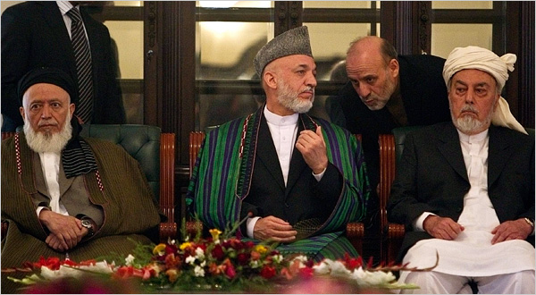 President Hamid Karzai of Afghanistan, center, speaking with his chief of staff, Umar Daudzai. Officials say Mr. Daudzai serves as a conduit for Iranian cash into the Karzai government and may be trying to poison Afghan relations with the United States. 
