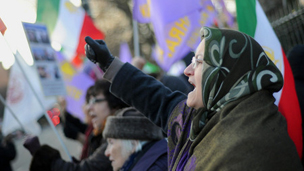 Protesters outside the London embassy waved purple flags and chanted slogans