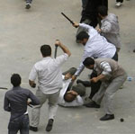 Basij forces beating protestors