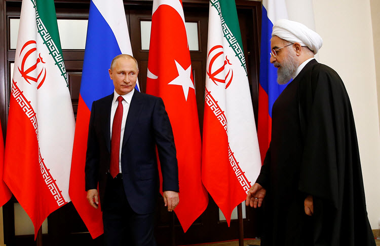 Russian President Vladimir Putin meets with his Iranian counterpart Hassan Rouhani