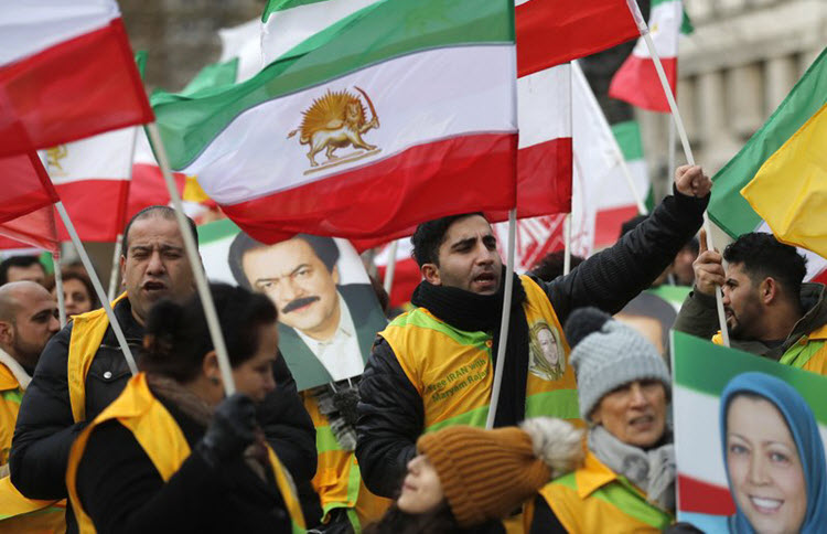 People take part in the demonstration 'Free Iran' organized by National Council of Resistance of Iran (NCRI)