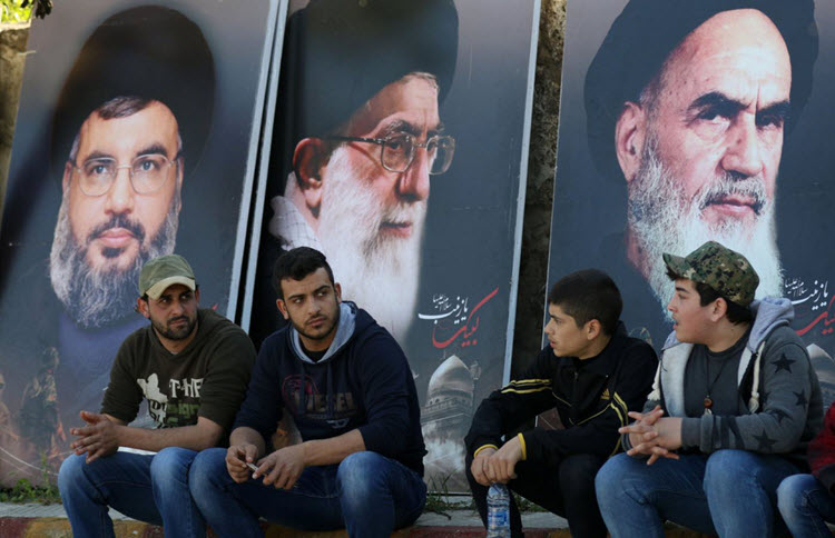 Images of Khomeini and Khamenei and Hassan Nasrallah