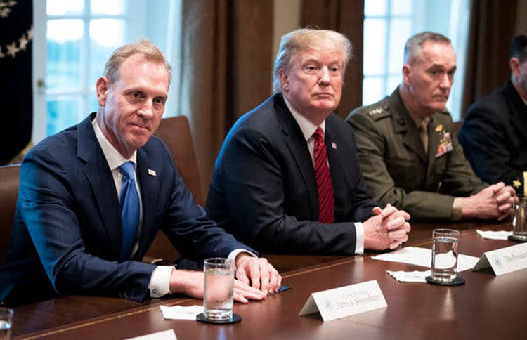 President Trump told Patrick Shanahan, left, the acting defense secretary, that he does not want to go to war with Iran.