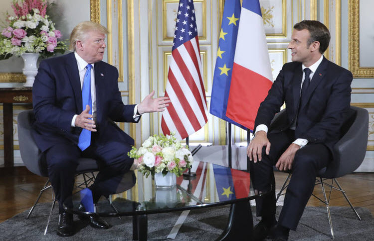 U.S President Donald Trump, left, talks to French President Emmanuel Macron