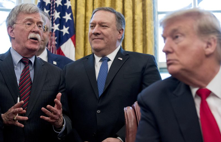 From left, National Security Adviser John Bolton, accompanied by Secretary of State Mike Pompeo, and President Donald Trump.