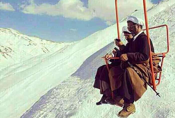 Two of Iran’s clerics take a ski-lift after a mountain walk