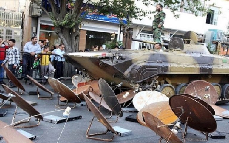 Iran's regime crushes satellite dishes with armored vehicles