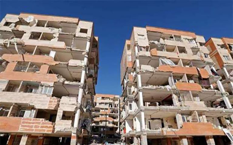 Building blocks left destroyed after an earthquake in Iran symbolize the country’s situation.